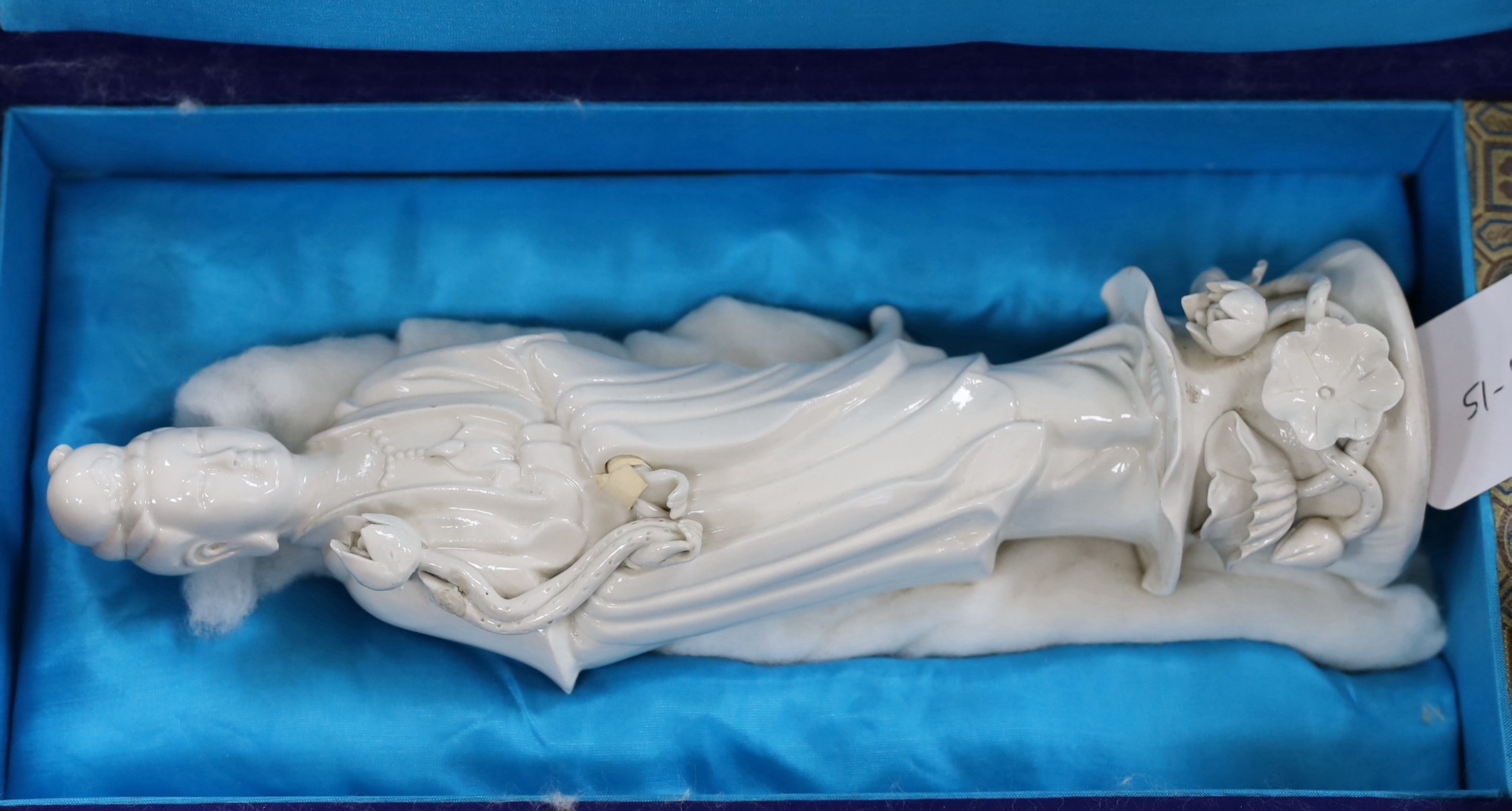 Four assorted boxed of jades and bowenite jades and a blanc de chine figure, 26.5cms high